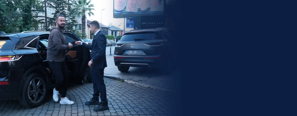 Patient stepping out of a private transfer car in front of Dr. Terziler Exclusive Clinic, Beşiktaş, Istanbul