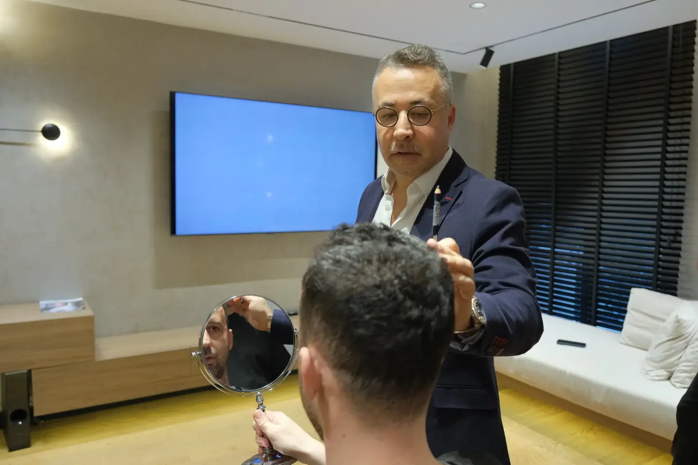 Hair transplant Turkey cost consultation: Dr. Servet Terziler planning a patient&rsquo;s hairline at Dr. Terziler Exclusive Clinic in Istanbul.